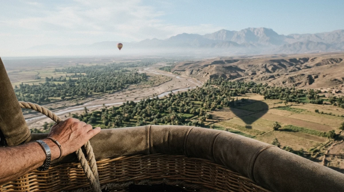 View over the basket rim above the palm groves north of the city on a hot air balloon Marrakech flight