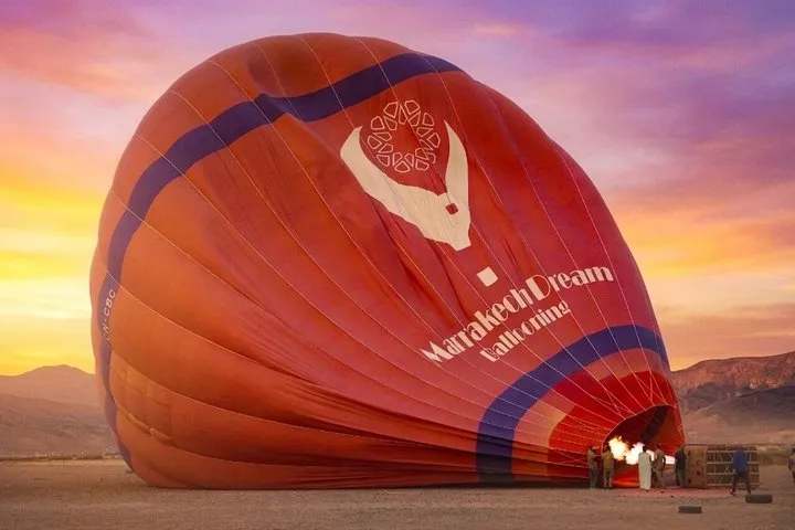 A hot air balloon basket over Marrakech desert terrain on a hot air balloon ride in Marrakech, Morocco